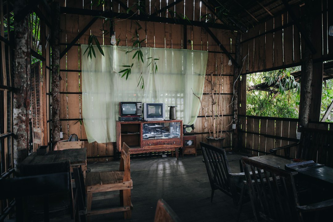 Television control room with multiple monitors and editing consoles