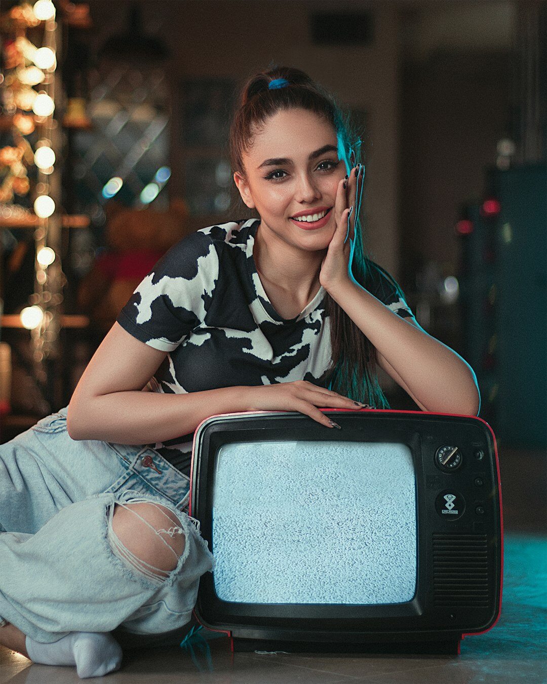 person relaxing with vintage tv remote
